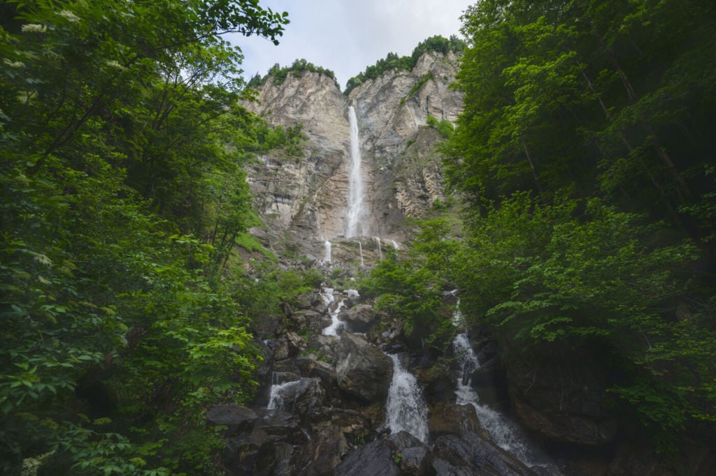 Muelibach Waterfall near Brienz. Waterfall from a tall rock face.