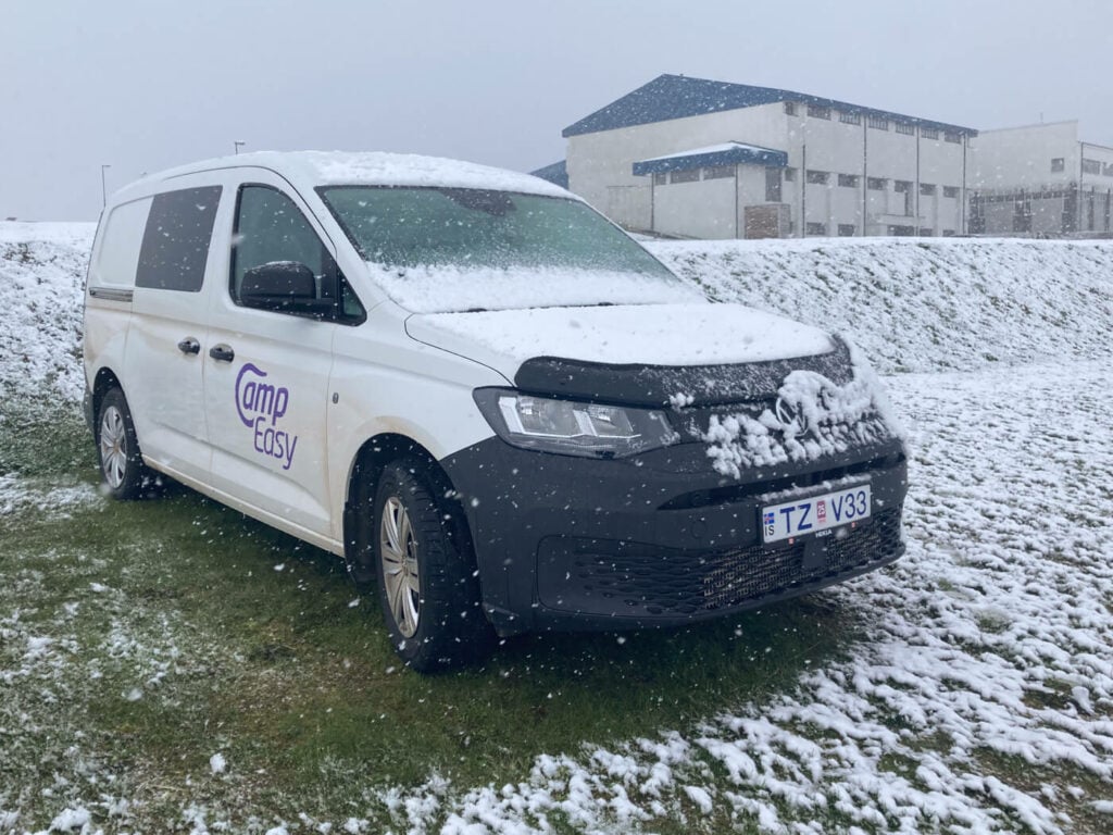 Campervan in Iceland under the snow during a road trip