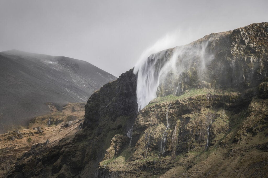 Bjanrafoss a waterfall falling off a cliff in the Snæfellsnes peninsula in Iceland