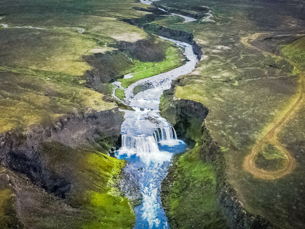 Aerial view from a drone of Axlafoss a small waterfall in a canyon in the highlands of Iceland