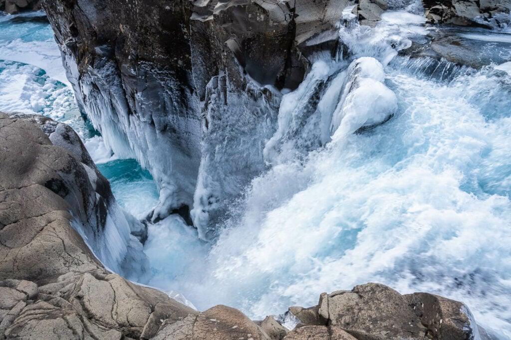 Sundássfoss waterfall in a narrow gorge between levigated rocks