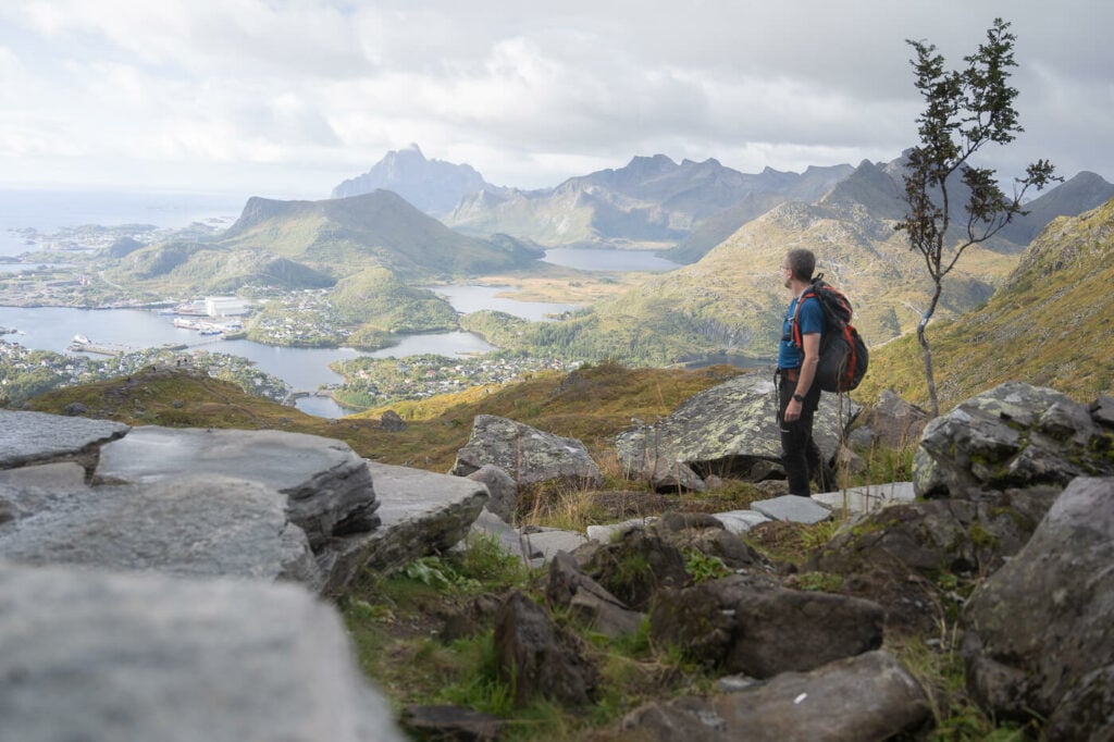 Hiker looking at the landscape around Svolvaer from the hiking trail to Djelveporten.