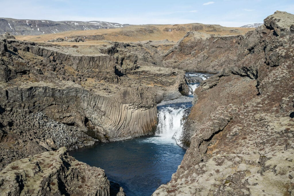 Bassi Waterfall in south Iceland in a small canyon with basalt columns on the side