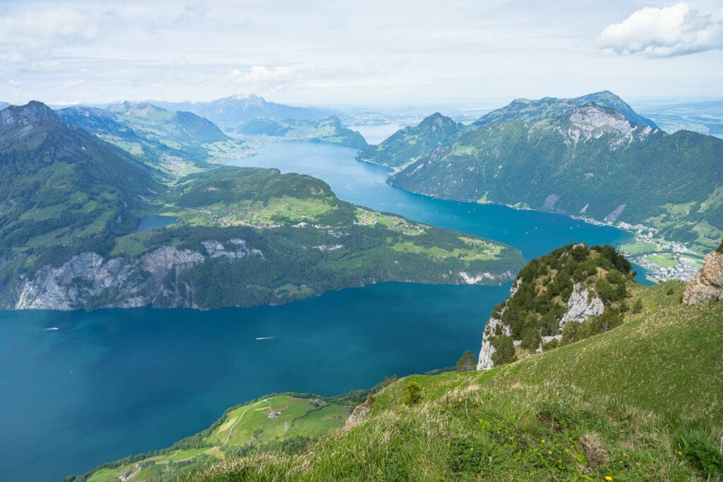 Panoramic image of the blue waters of Lake Lucerne from the hiking trail to Fronalpstock.