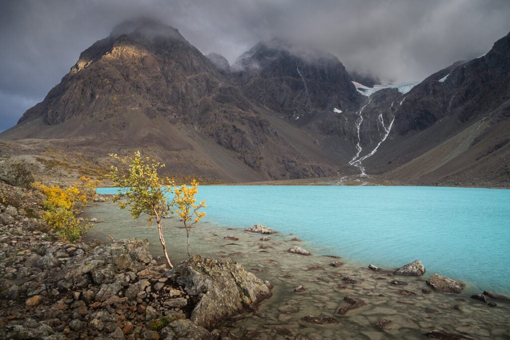 Landscape of the Lyngen Alps around Blåisvatnet with some light on the mountains 