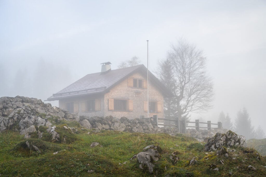 Swiss mountain hut in the fog