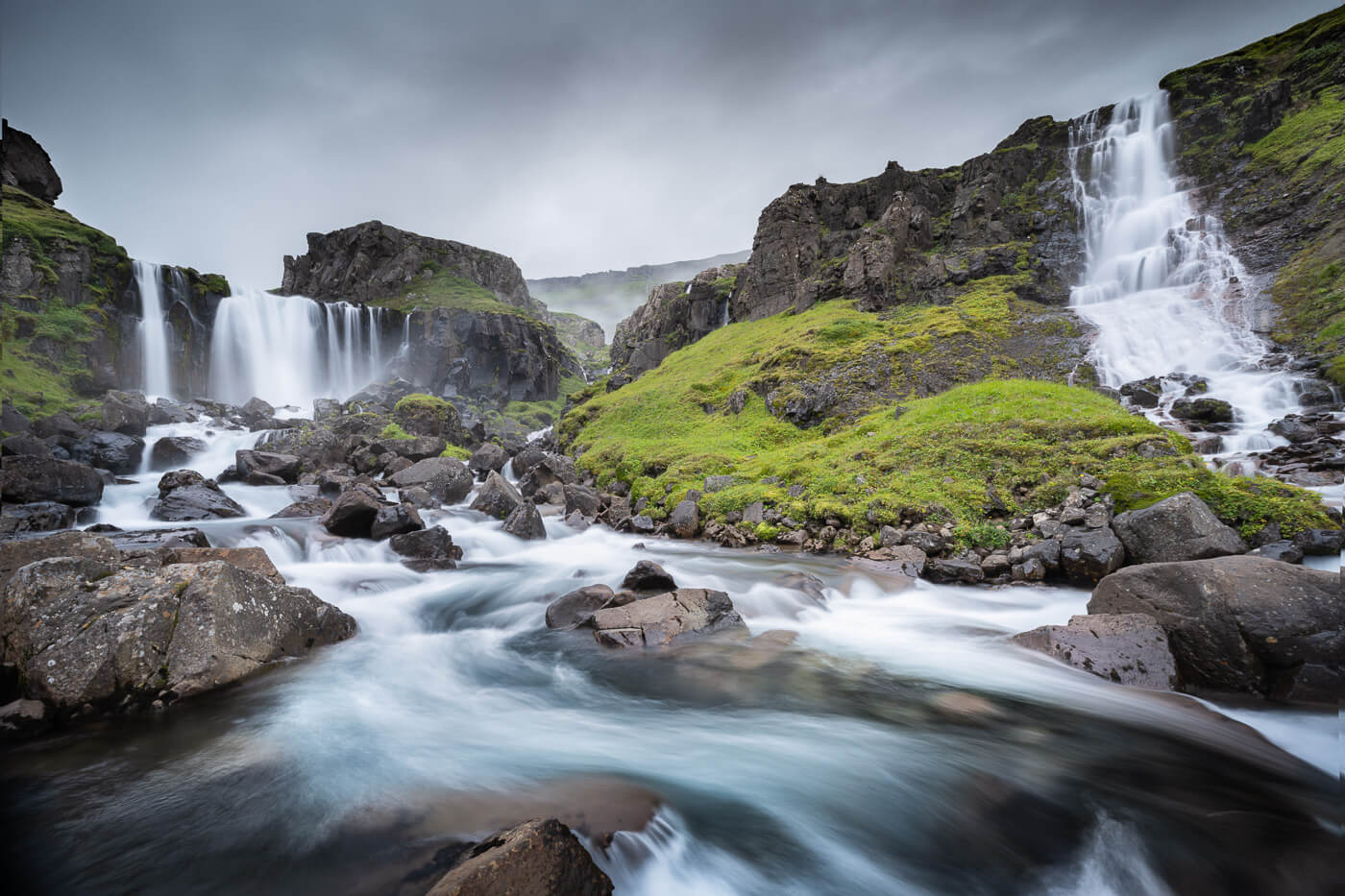 View of several waterfalls called vwestdalsfossar on the sides of a small ravine