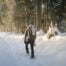 Hiker on snow with the Lowepro Photosport Pro 70l aw iii camera backpack