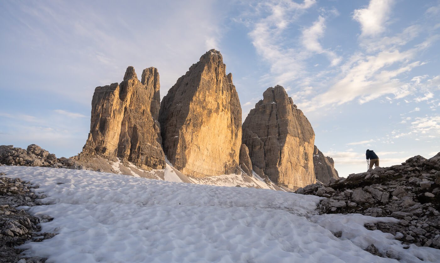 A photographer taking photos of Tre Cime di Lavaredo