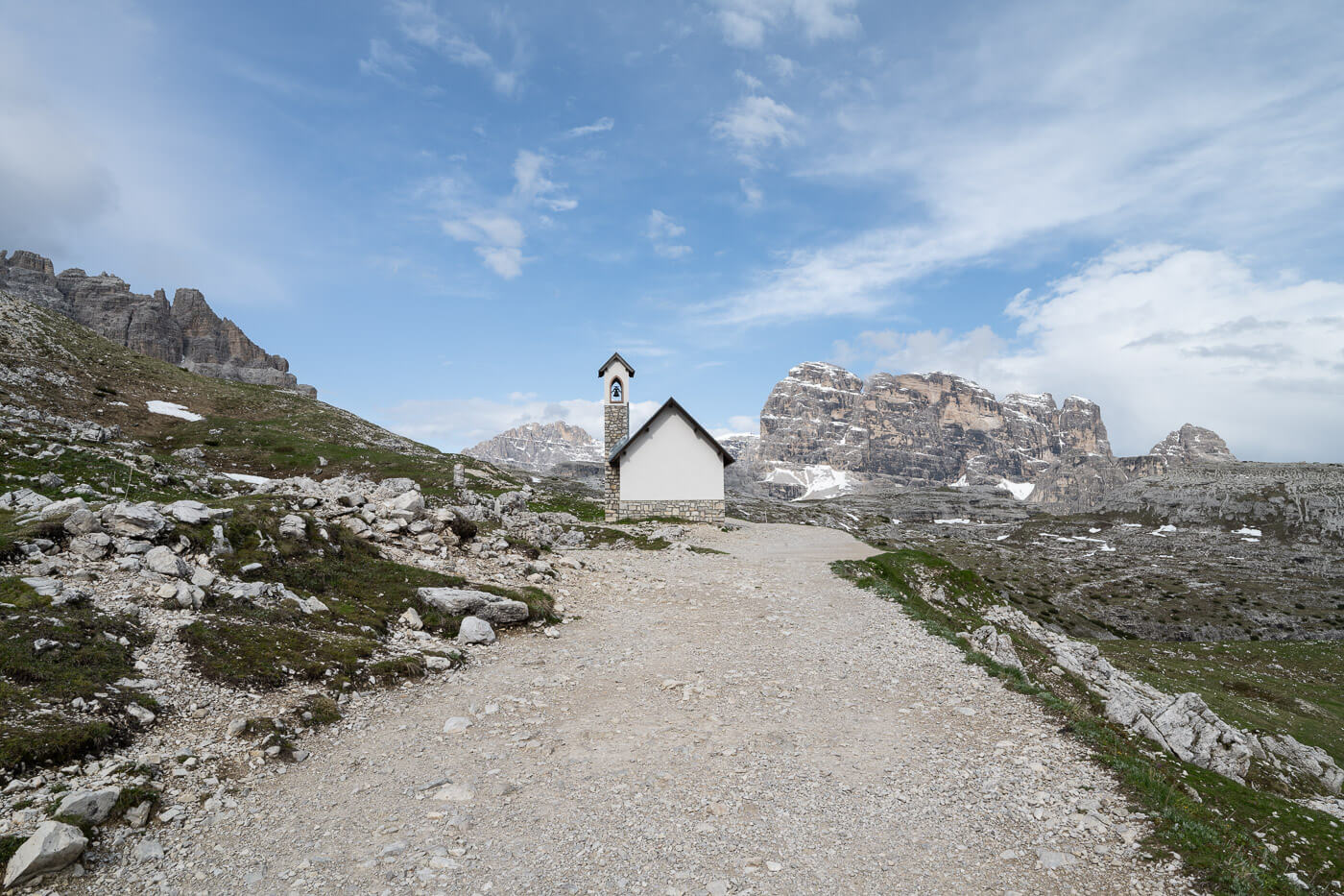 Littel chapel on a gravel road in the dolomites.