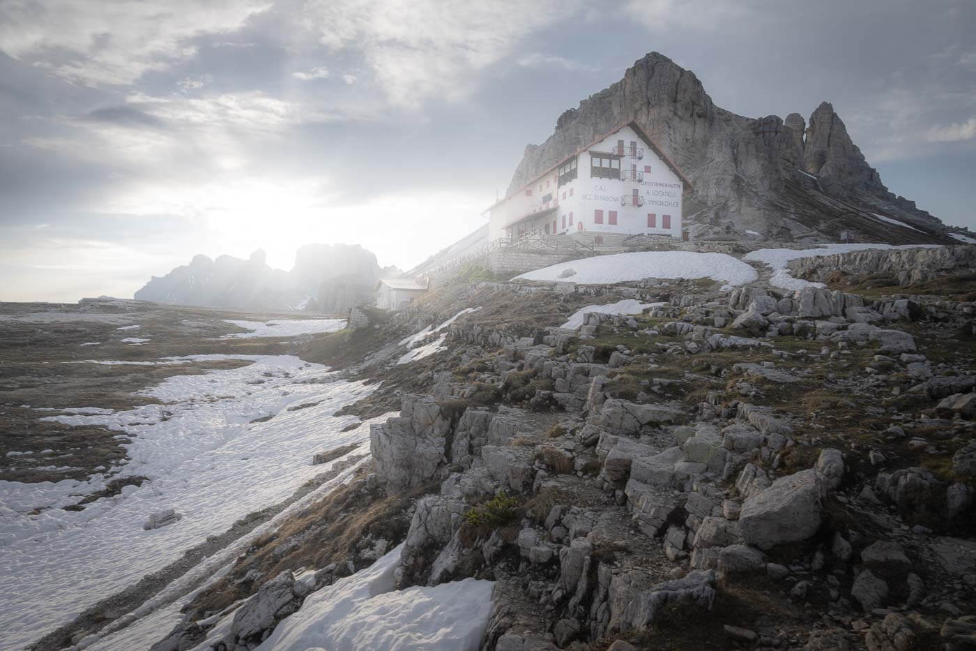 RIfugio Locatelli surrounded by the soft light of a late summer afternoon.