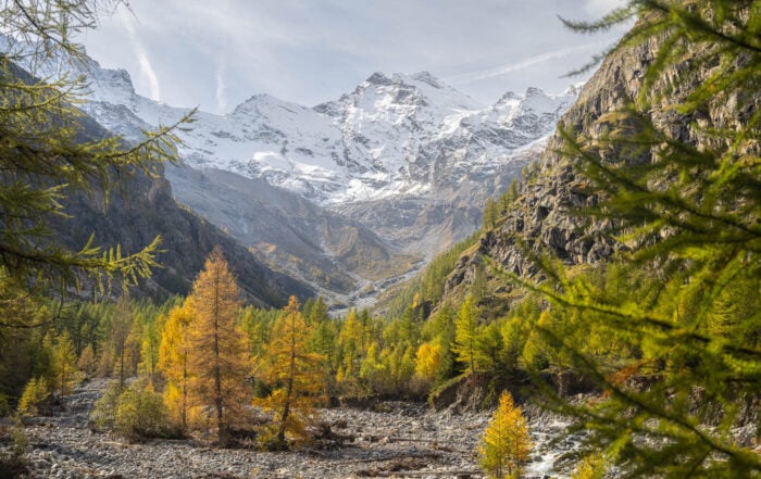 View of the Gran Paradiso massif on a sunny day from the hiking trail to Alpe Money in Valnontey,