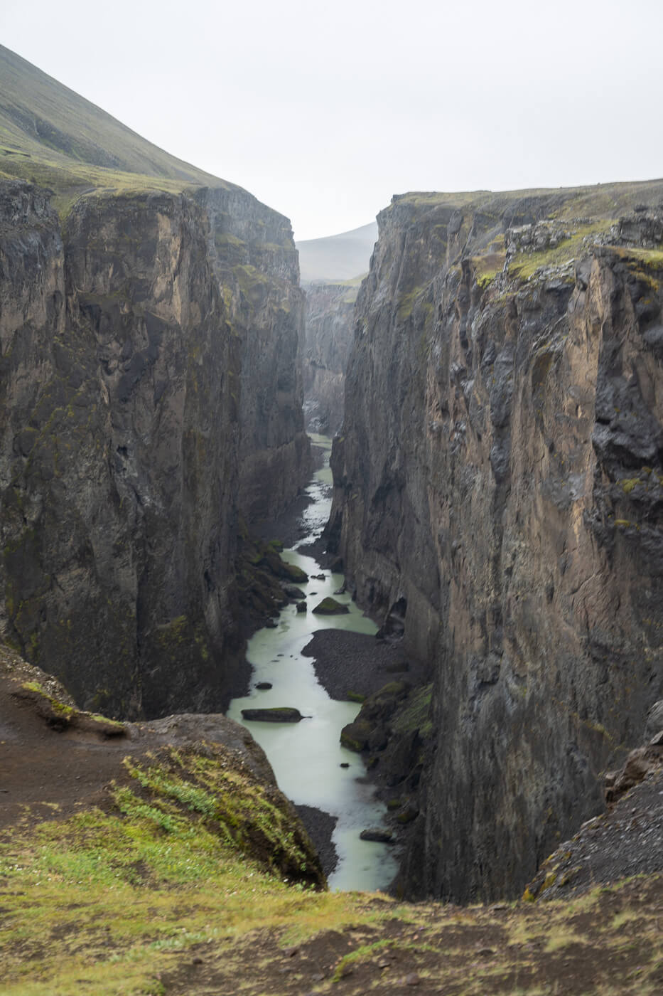 View of Hafrahvammagljufur' Canyon from a viewpoint you can only hike to, with the turquoise waters of the river down below