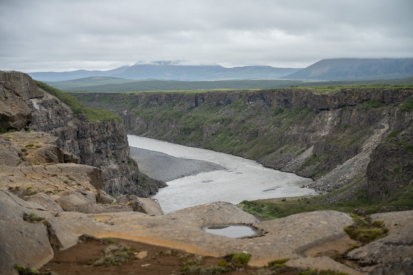Jökulsárgljúfur canyon with mountains in the distance.