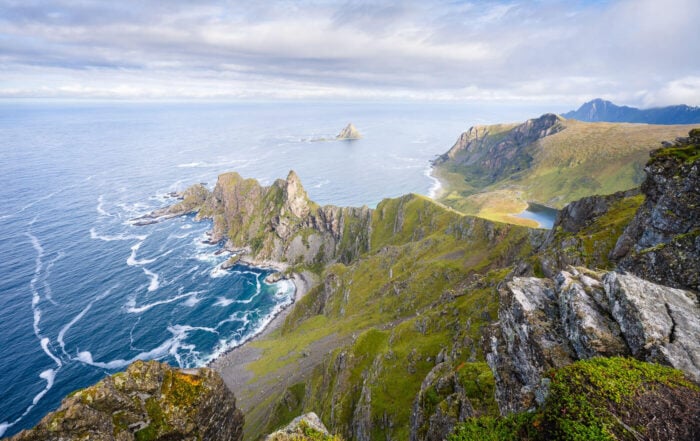 View from the top of Måtinden, the main hiking attraction in Andøya, on a partially cloudy day, in the morning sun.