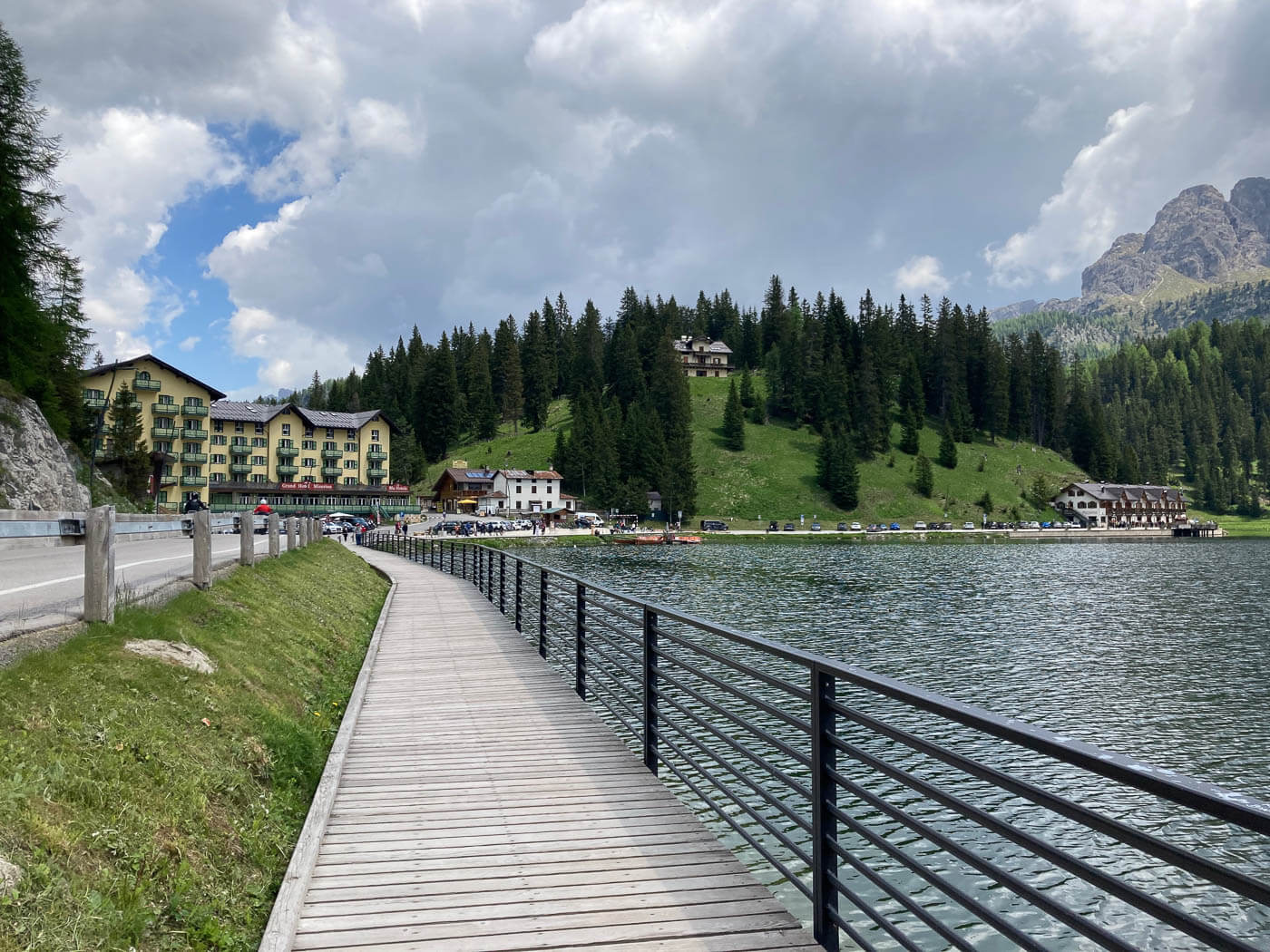 boarded walk near a lake in the italian alps.