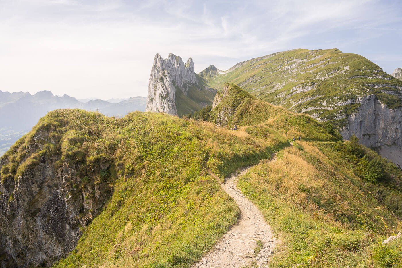 View of a ridge trail in the Alpstein mountain on the loop hike to Saxer Lücke and Fählensee from Hoher Kasten.