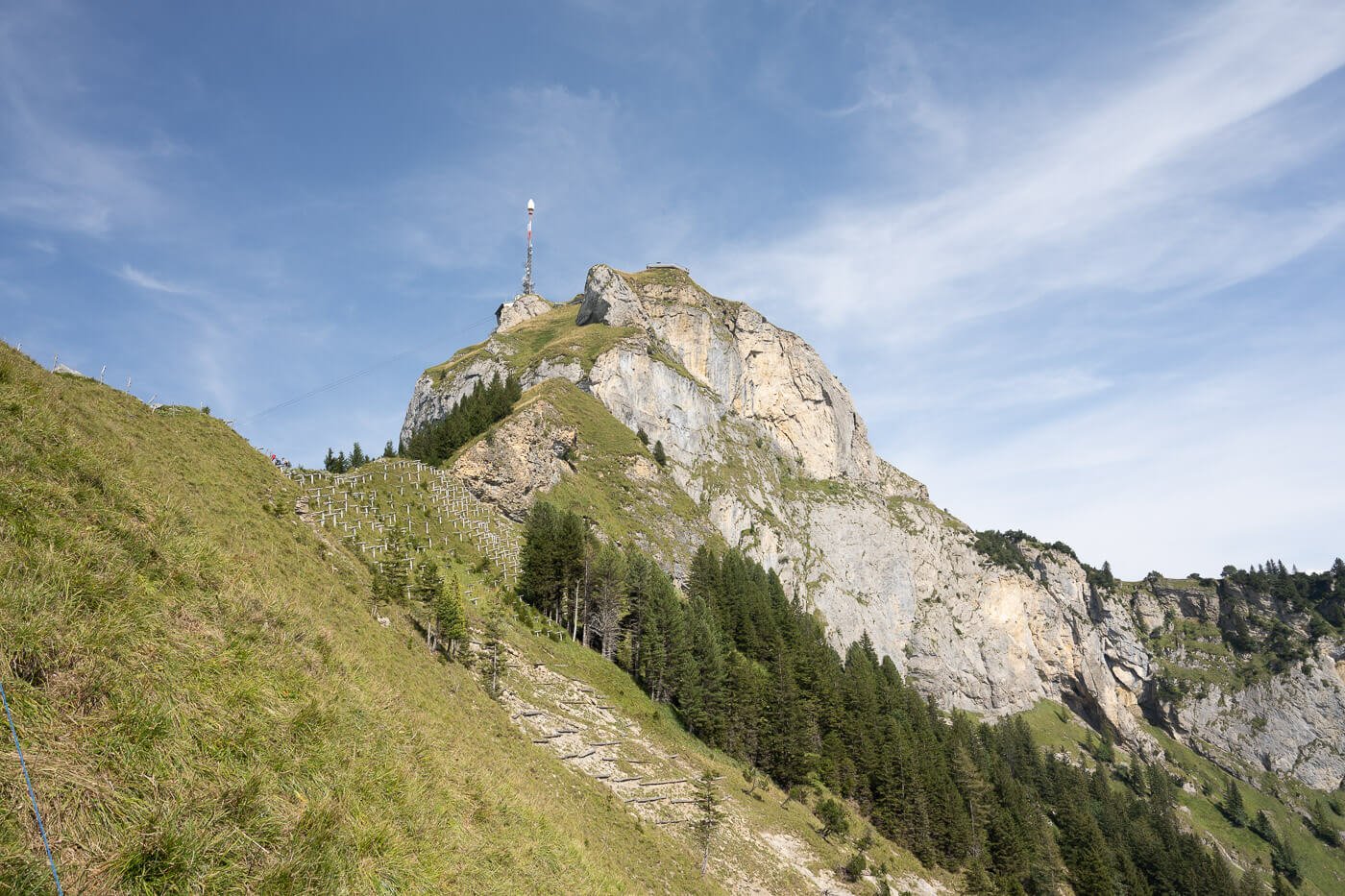 View of the top of Hoher Kasten with the mast on top of it from the hiking trail that leads up to it,