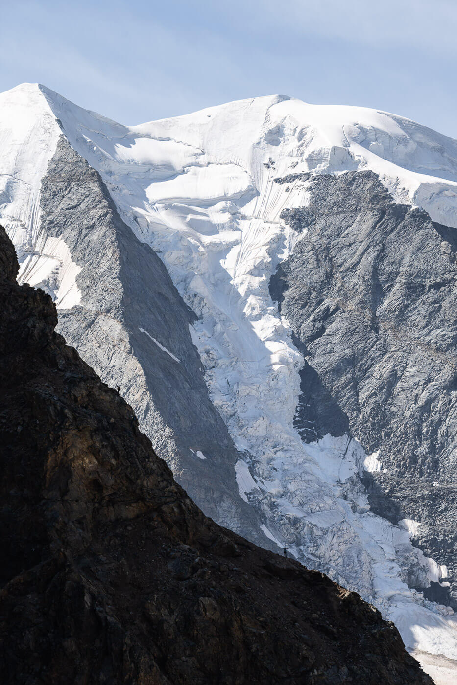 View of the silhouette of a mountain newar Diavolezza with another mountain with a glacier in the background