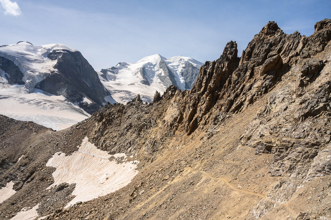 Exposed trail around Piz trovat in the Bernina range.