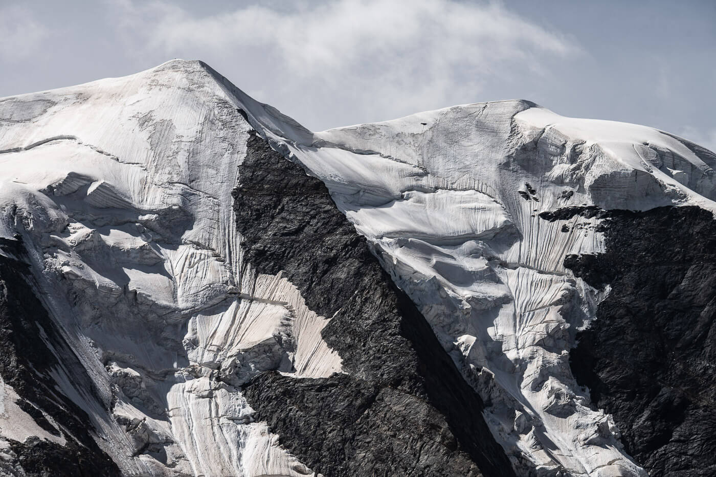 View of mountain tops covwered in glaciers in switzerland