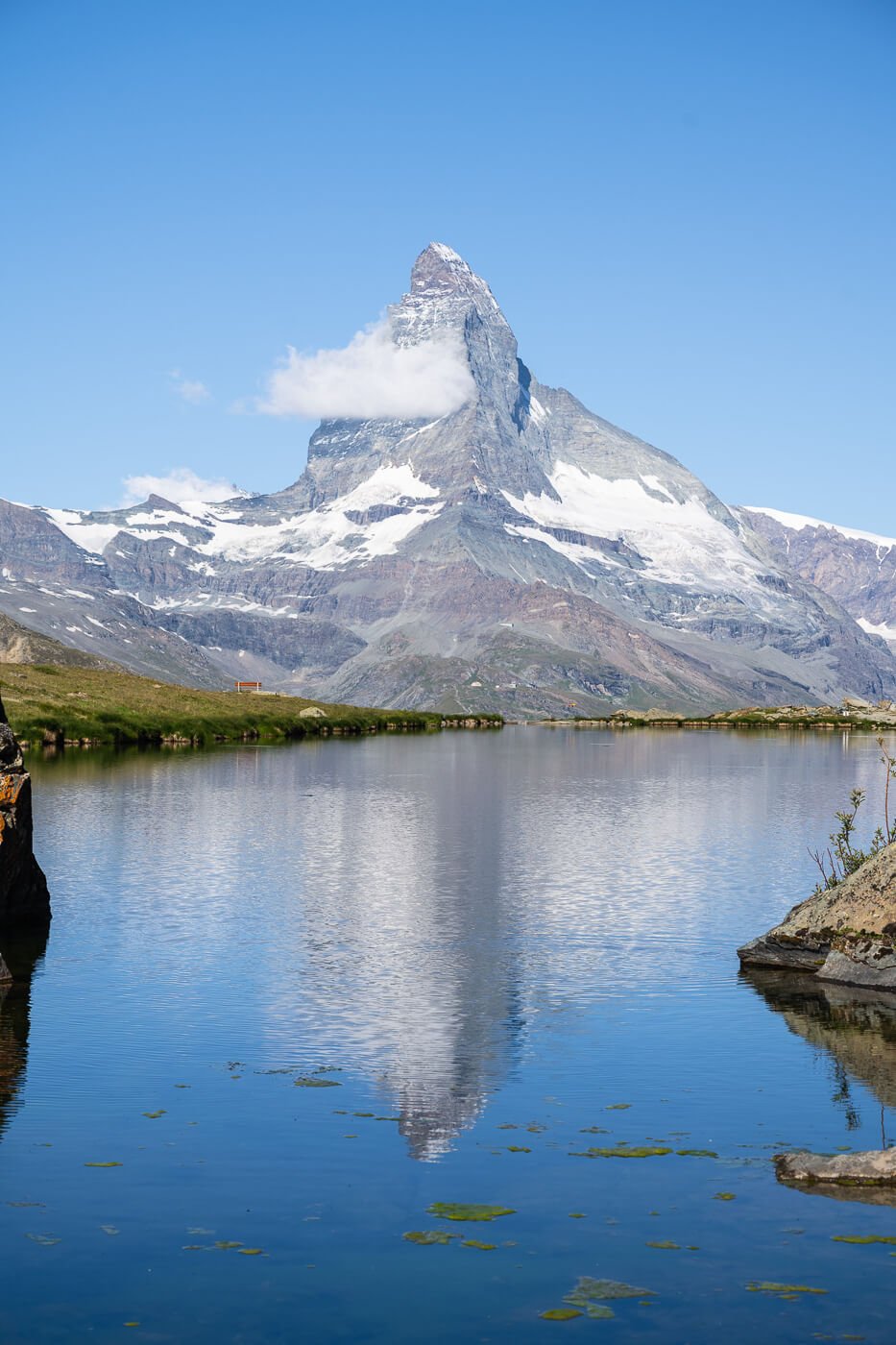 View of the Matterhorn and its reflection in Stellisee, which is the most popular viewpoint on the Stellisee and five lakes hike in Zermatt.