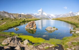 View of Stellisee and the viewpoint of the metterhorn reflecting in the lake