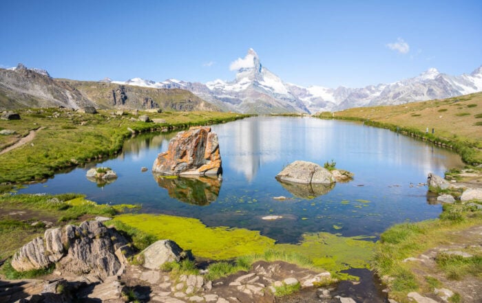 View of Stellisee and the viewpoint of the metterhorn reflecting in the lake