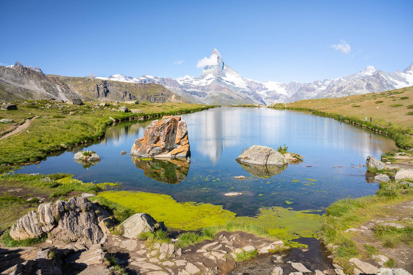 View of Stellisee and the viewpoint of the metterhorn reflecting in the lake
