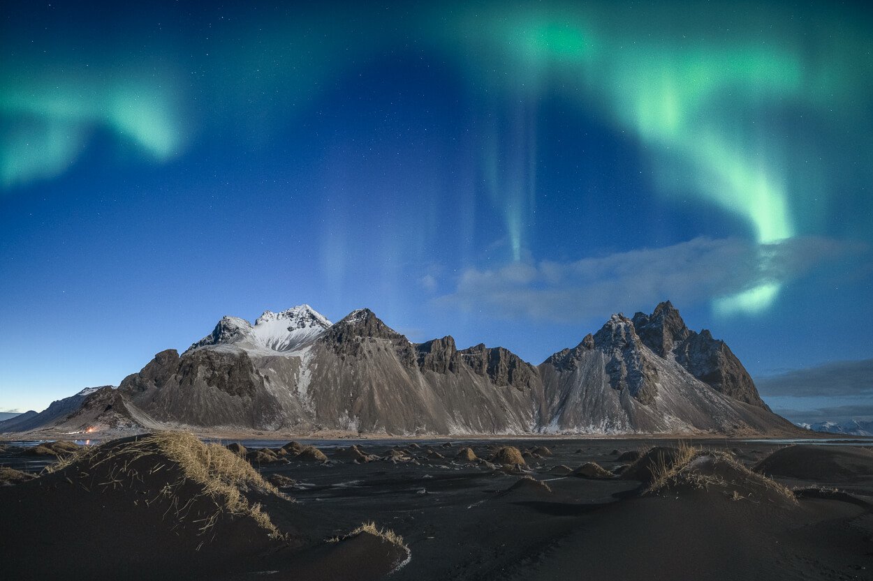 Aurora Borealis above Vestrahorn in Iceland in a winter night.