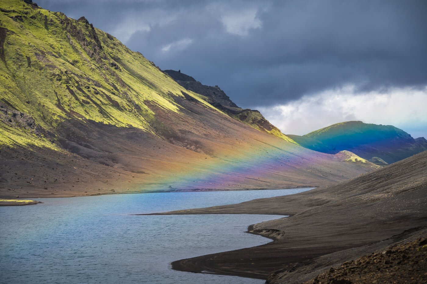 Rainbow above Langisjór lake in a landcape photo taken with the Nikkor Z 28-400.