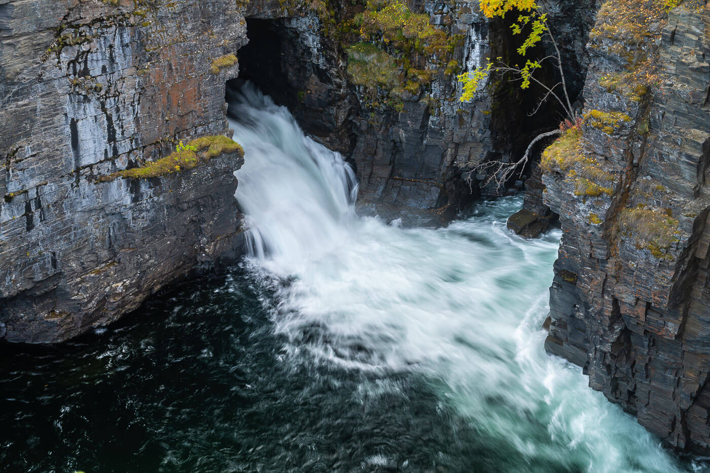 Abisko Canyon waterfall coming out of the rocks