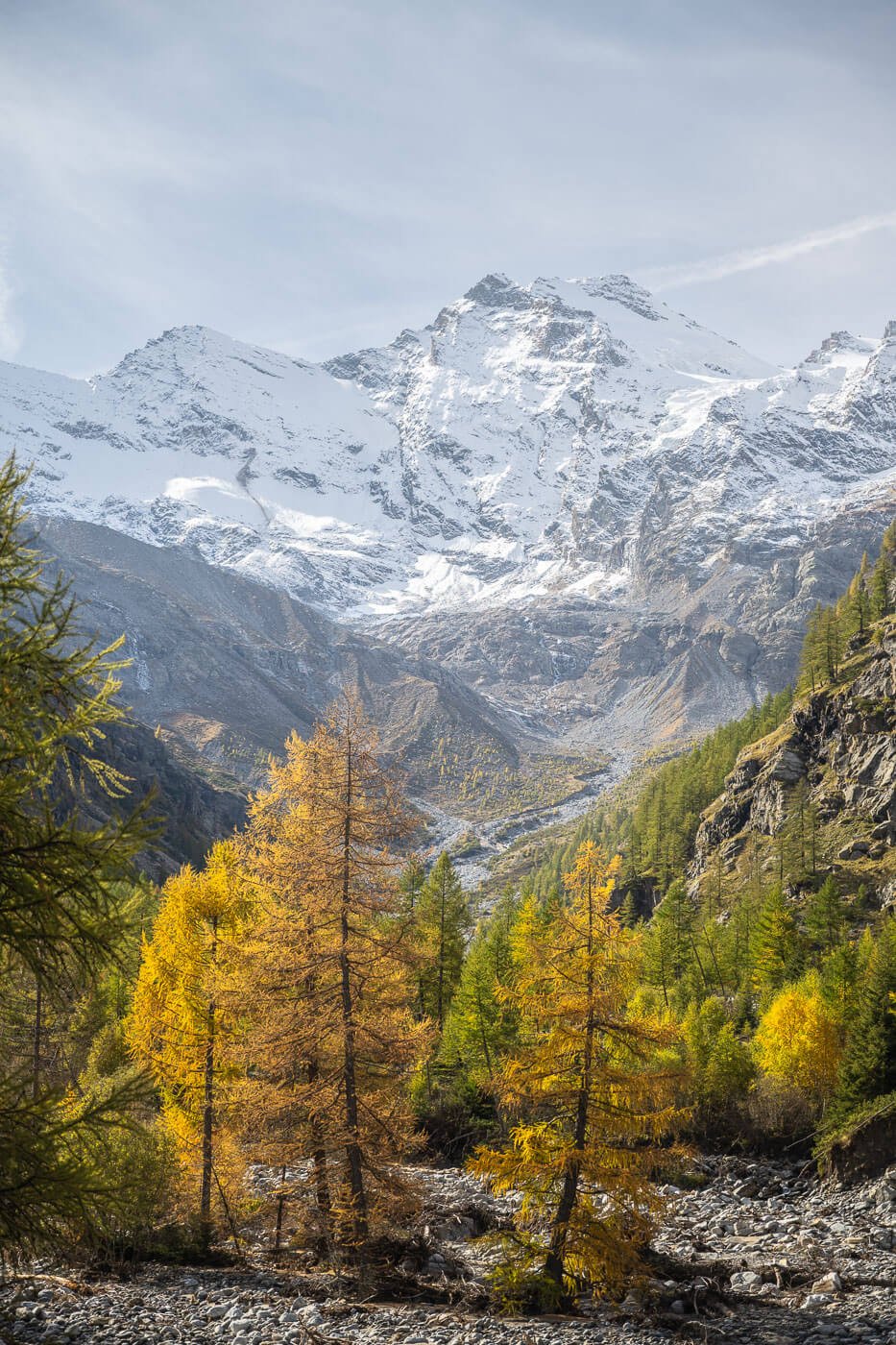 Autumn Landscape with mountains covered in the first, light snow of the year in autumn.