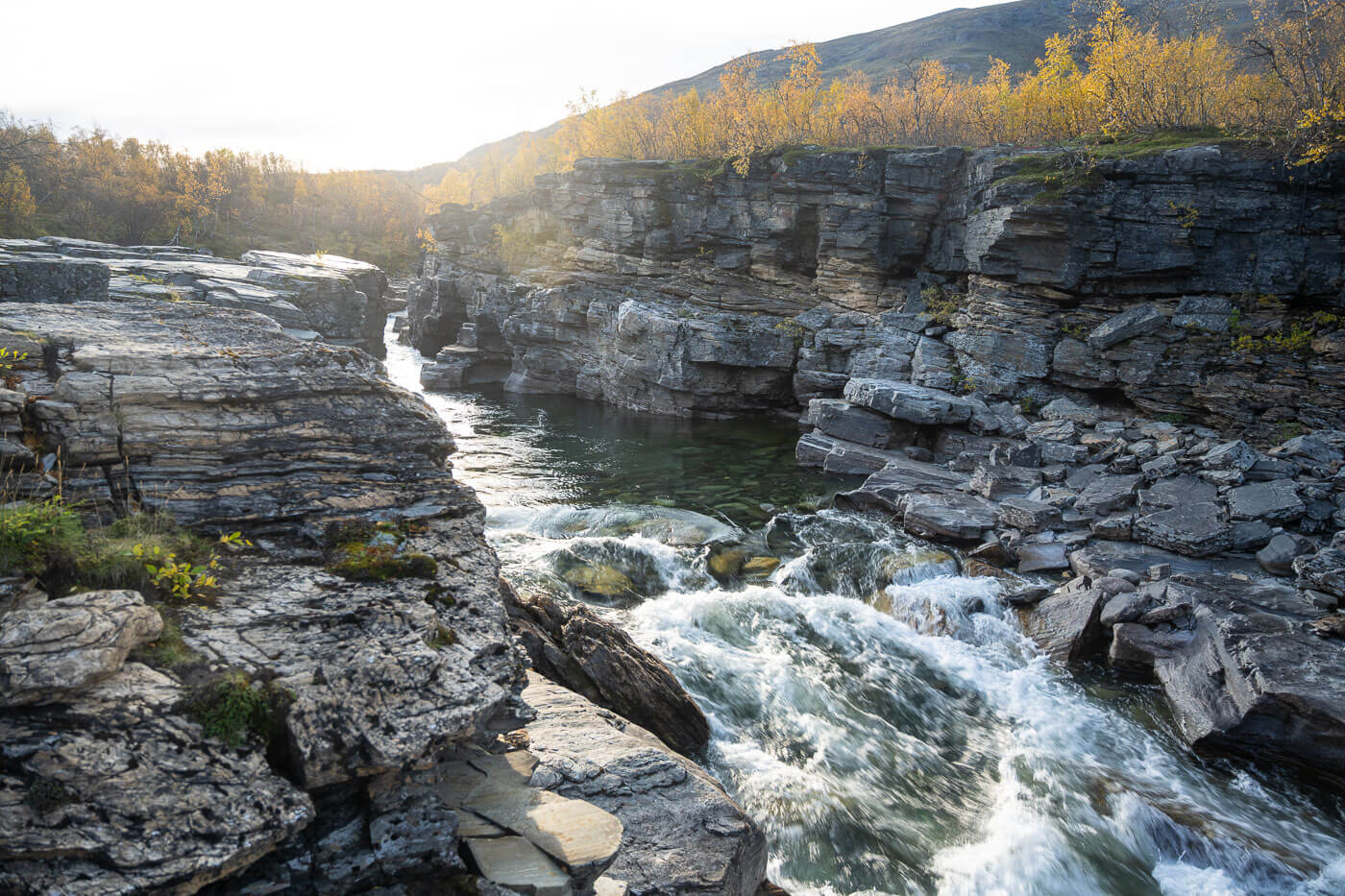 Abiskojokk river in autumn, viewed from the Njakajaure Hiking Trail