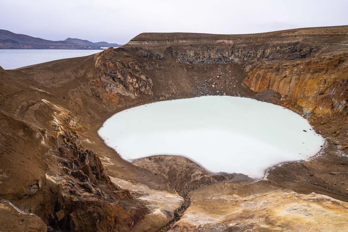 A colorful geothermal crater you can bathe in in Iceland.