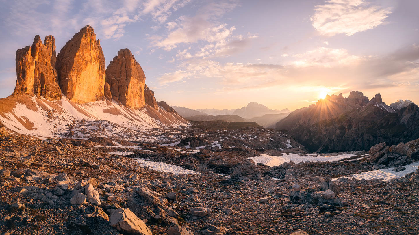 Panoramic view of Le Tre Cime at sunset, one of the best hikes and photo spots in the Dolomites