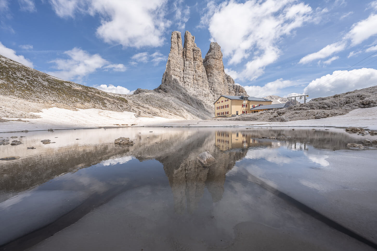 View of Torri del Vajolet and the Re Alberto hut on a Sunny Day.