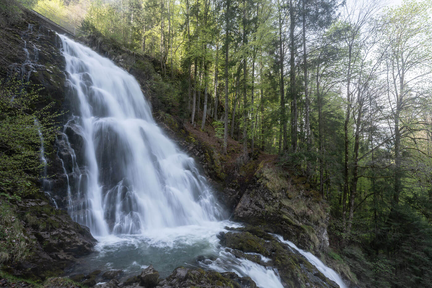 View of a Giessbach waterfall in the forest you can only hike to