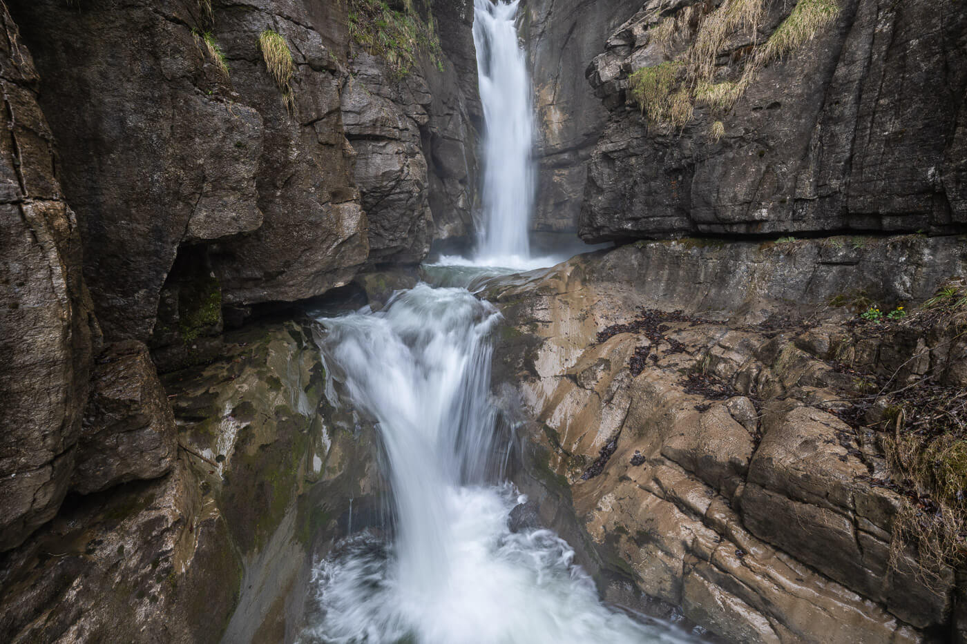 Upper Giesshbach waterfall, a two-step waterfall carved in the rocks.