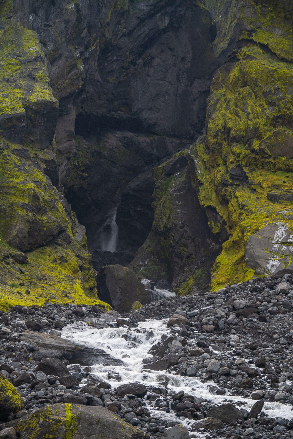 Waterfall and small creek in a narrow ravine