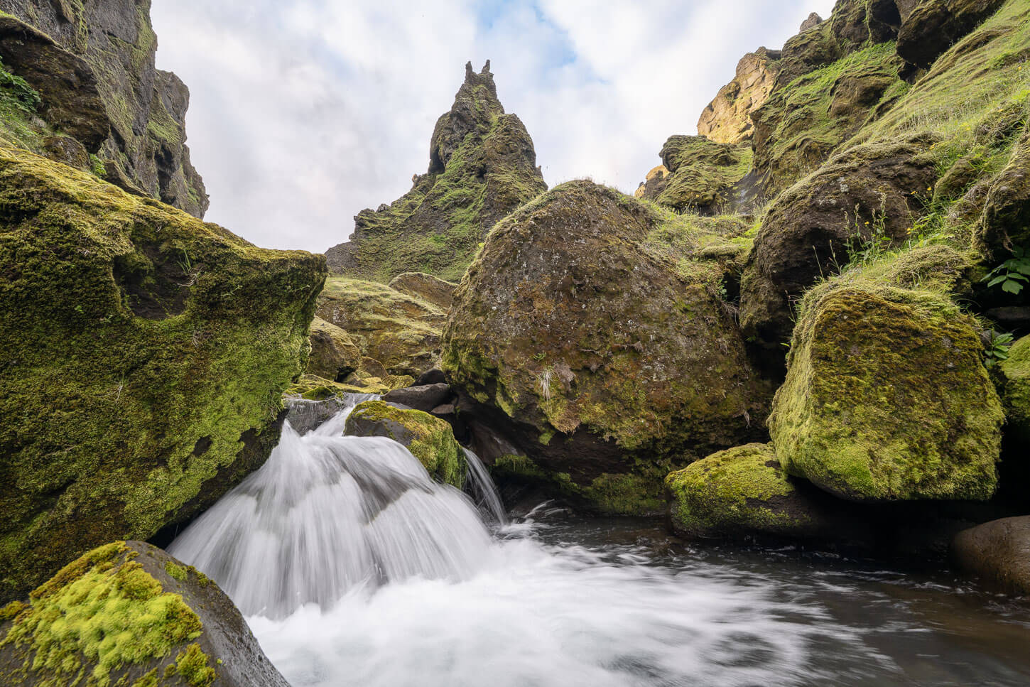 Waterfall with green moss rocks in Thakgil