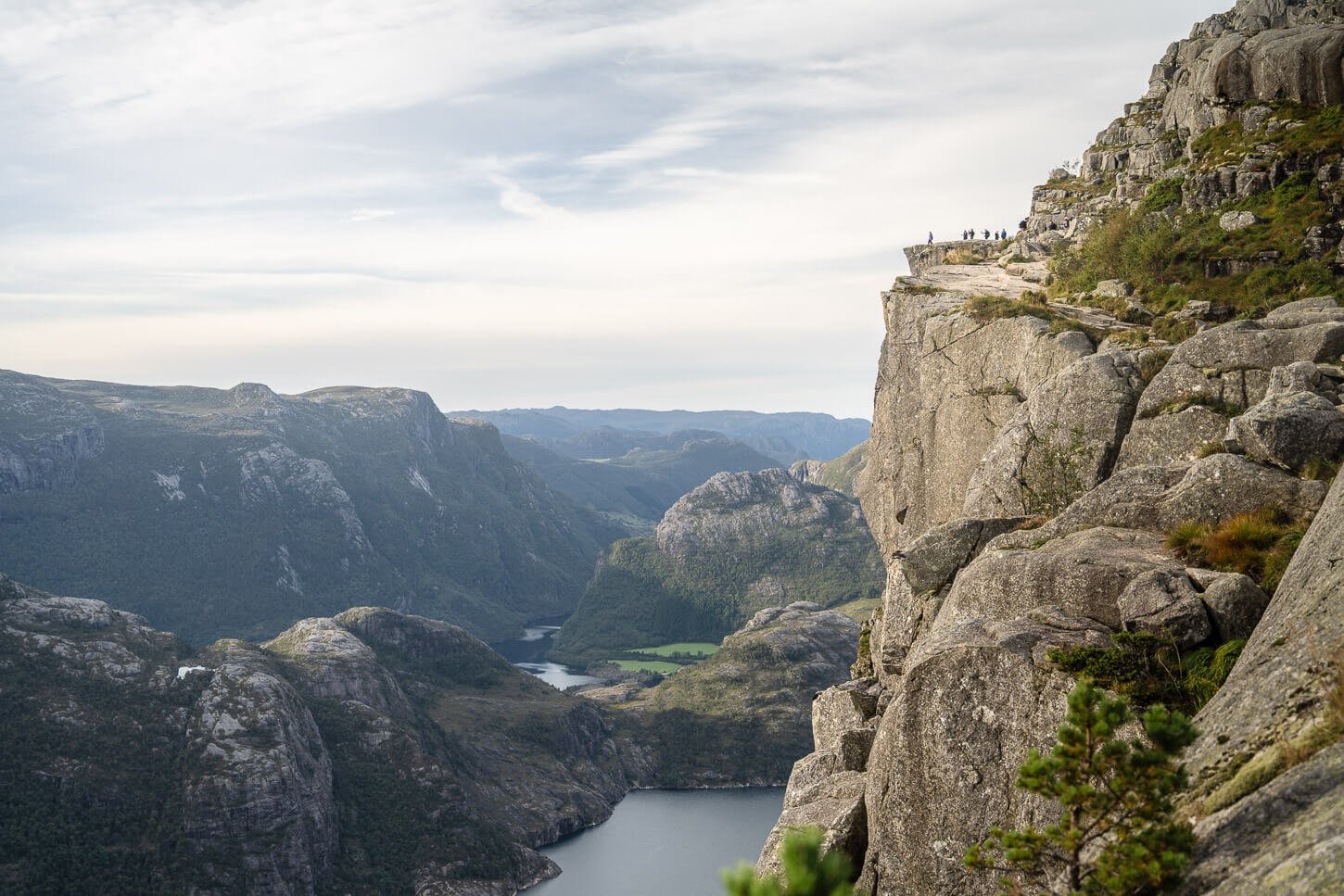View of Preikestolen or the Pulpit rock from a distance on the trail that leads to it.