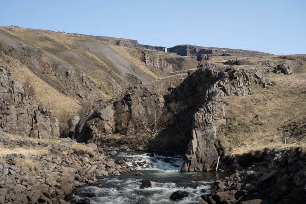 View of the upper part of Hengifoss from the bridge across the river.
