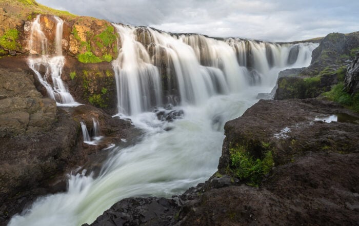 View of Kolufoss, a waterfall above the Kolugljúfur canyon.