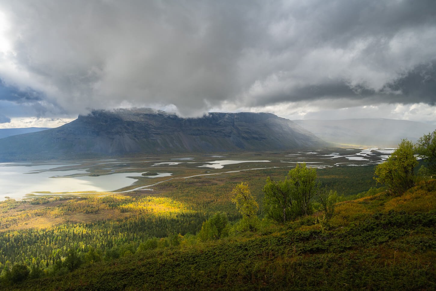 Dramatic light and coulds above the Rapa valley in Swedish Lapland