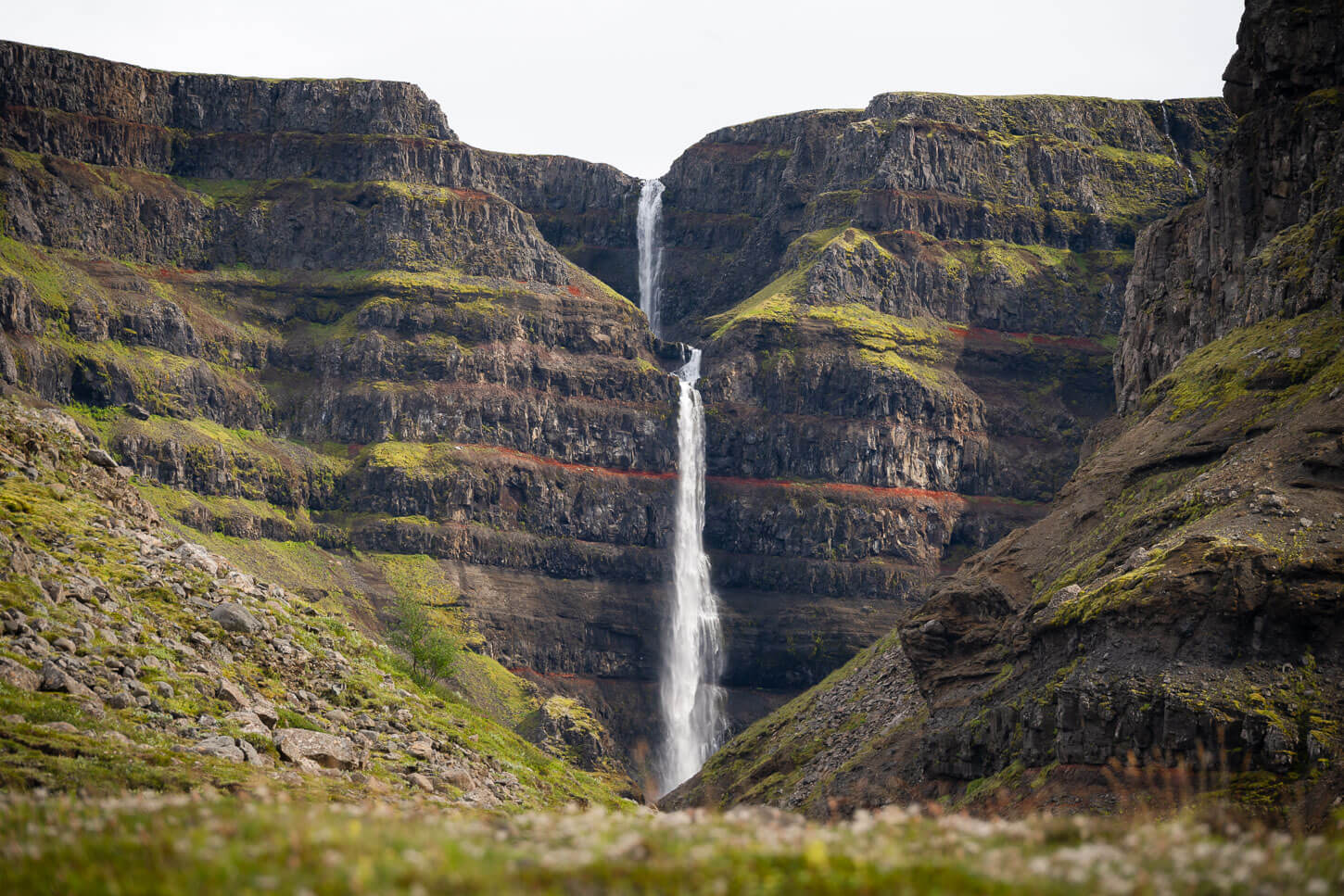View of the Waterfall Strútsfoss from the hiking trail that leads to it.