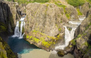 Hvítárfoss and Núpsárfoss, two waterfall with water of different colors