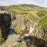 View of Hvitárfoss and Núpsárfoss, twin waterfalls with waters of different colors