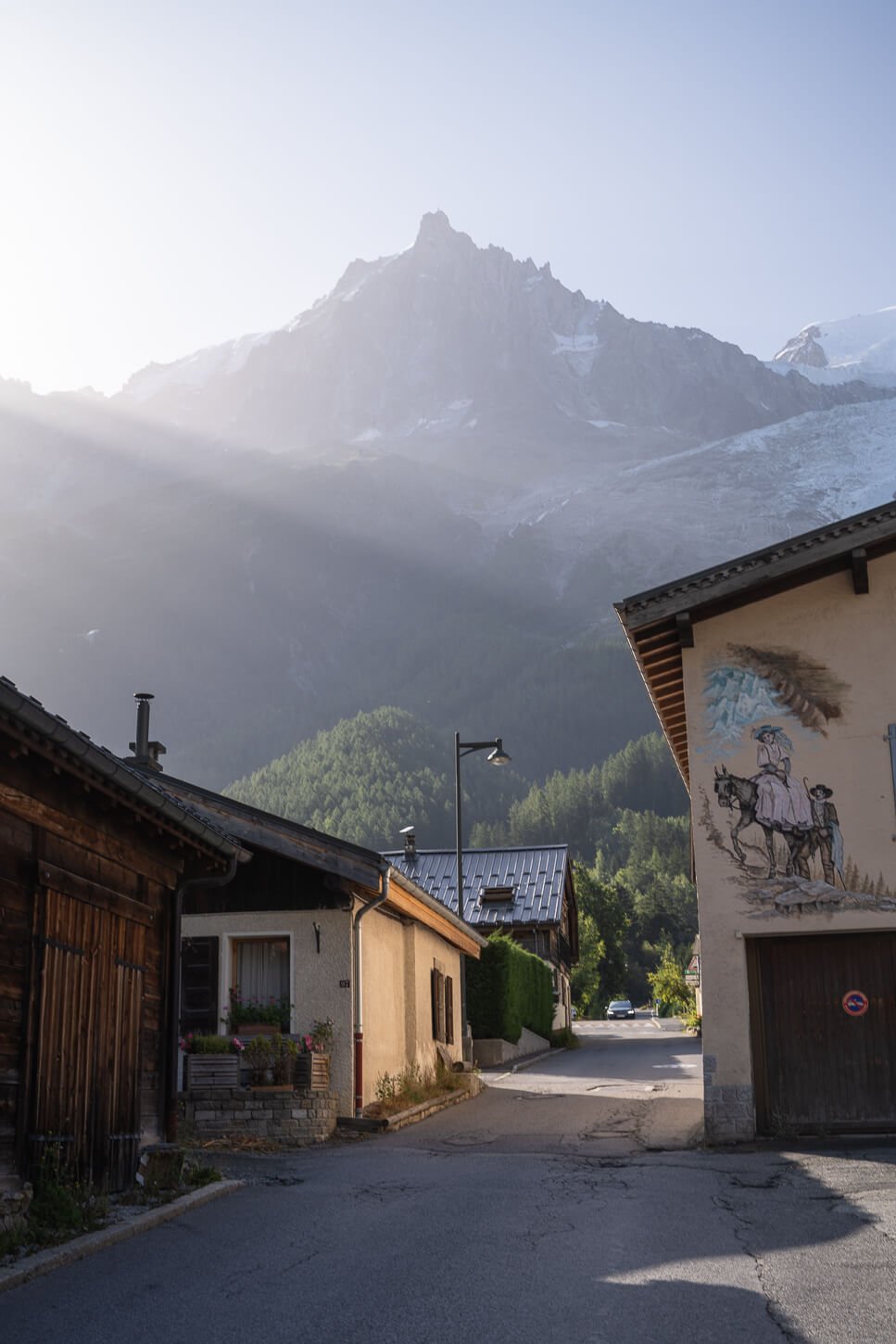 View of the village Les Bossons with mountains in the background in the morning light.