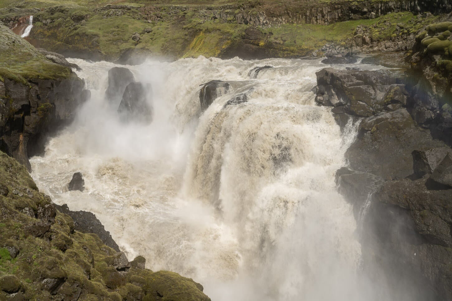 Lambhagafoss waterfall a waterfall with silt-ruch waters